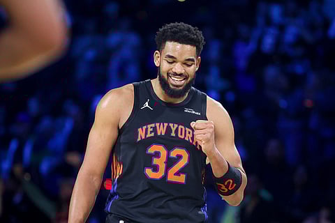 New York Knicks center Karl-Anthony Towns (32) reacts during the closing seconds in the second half of the NBA Cup championship basketball game against the San Antonio Spurs in Las Vegas.