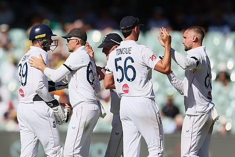 England's Will Jacks, right, celebrates the wicket of Australia's Alex Carey with his team mates during play on day one of the third Ashes cricket test between England and Australia at the Adelaide Oval in Adelaide, Australia.