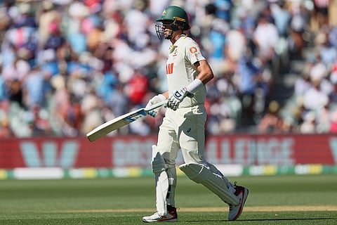 Australia's captain Pat Cummins leaves the field after losing his wicket during play on day one of the third Ashes cricket test between England and Australia at the Adelaide Oval in Adelaide, Australia.