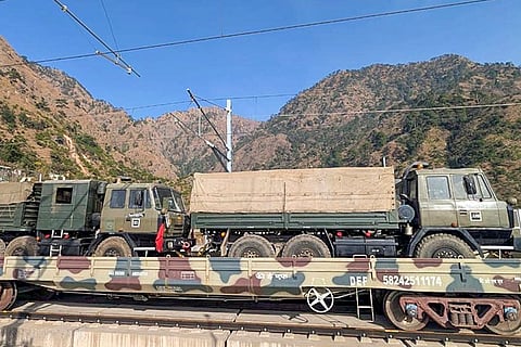 Army trucks loaded on a special military train move along the Jammu-Srinagar rail route during routine strategic deployment towards the Kashmir region, amid heightened logistical preparedness, in Jammu.