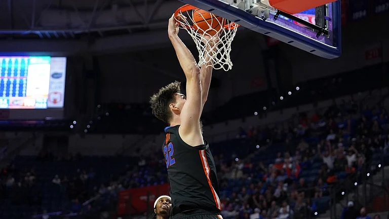 Florida center Olivier Rioux (32) dunks the ball against Saint Francis during the second half of an NCAA college basketball game Wednesday, Dec. 17, 2025, in Gainesville, Fla - AP