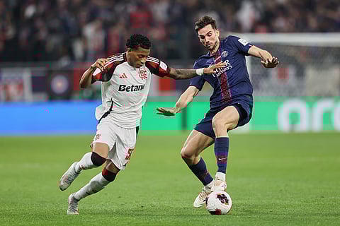 PSG's Fabian Ruiz, right, fights for the ball with Flamengo's Gonzalo Plata during the FIFA Intercontinental Cup final soccer match between Flamengo and Paris Saint-Germain in Doha, Qatar.