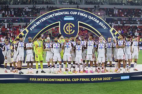 Flamengo players stand on the podium after lost the FIFA Intercontinental Cup final soccer match between Flamengo and Paris Saint-Germain in Doha, Qatar.