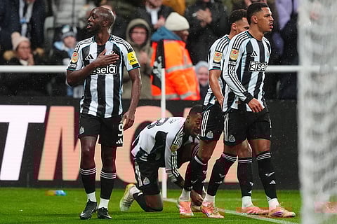 Newcastle United's Yoane Wissa, left, celebrates after scoring his sides first goal during the English League Cup quarter final soccer match between Newcastle and Fulham in Newcastle upon Tyne, England.