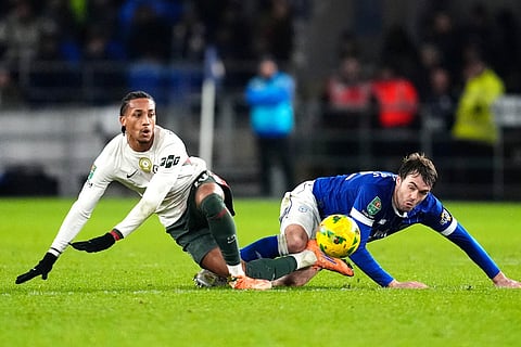 Chelsea's Joao Pedro, left, and Cardiff City's Calum Chambers battle for the ball during the English League Cup quarterfinal soccer match in Cardiff.