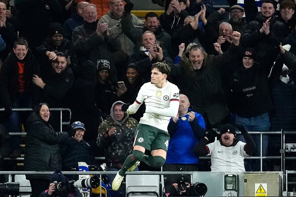 Chelsea's Alejandro Garnacho, left, scores their third goal of the game against Cardiff City during the English League Cup quarterfinal soccer match in Cardiff. - | Photo: Nick Potts/PA via AP