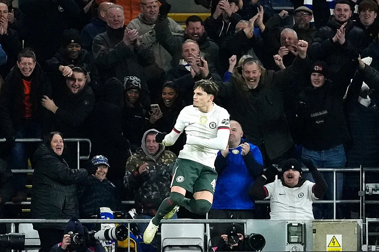 Chelsea's Alejandro Garnacho, left, scores their third goal of the game against Cardiff City during the English League Cup quarterfinal soccer match in Cardiff. - | Photo: Nick Potts/PA via AP