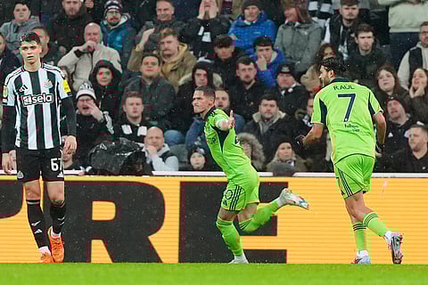 Fulham's Sasa Lukic celebrates after scoring his sides first goal during the English League Cup quarter final soccer match between Newcastle and Fulham in Newcastle upon Tyne, England.