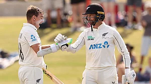 Opta : Tom Latham (L) celebrates his century with fellow New Zealand opener Devon Conway