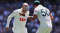 AP : Australia's Nathan Lyon, left, celebrates with teammate Mitchell Starc after dismissing England's Ben Duckett during play on day two of the third Ashes Test.