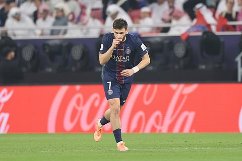 PSG's Khvicha Kvaratskhelia celebrates after scoring his side's opening goal during the FIFA Intercontinental Cup final soccer match between Flamengo and Paris Saint-Germain in Doha, Qatar.
