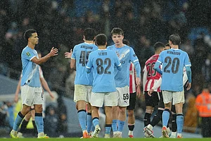 | Photo: AP/Jon Super : Manchester City's Rico Lewis shakes hands with Manchester City's Charlie Gray after the English League Cup soccer match between Manchester City and Brentford in Manchester, England.