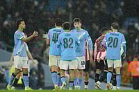 EFL Cup 2025-26: Pep Guardiola's Manchester City Ease Past Brentford To Book Semi-Finale Ticket | Photo: AP/Jon Super : Manchester City's Rico Lewis shakes hands with Manchester City's Charlie Gray after the English League Cup soccer match between Manchester City and Brentford in Manchester, England.