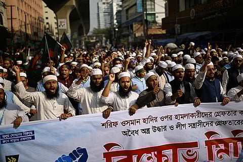 Supporters and members of various Islamist parties shout slogans during a protest following overnight attacks and vandalism after the death of a prominent activist, who was shot by an assailant a week ago, in Dhaka, Bangladesh.