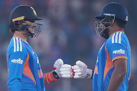 India's Abhishek Sharma, left, and Sanju Samson encourage each other as they bat during the fifth T20 cricket match between India and South Africa in Ahmedabad.