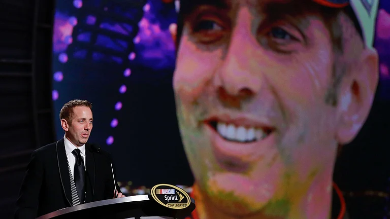 Greg Biffle speaks during the season-ending NASCAR awards ceremony while accepting the award for his fifth-place finish in the NASCAR Sprint Cup title race - File/AP