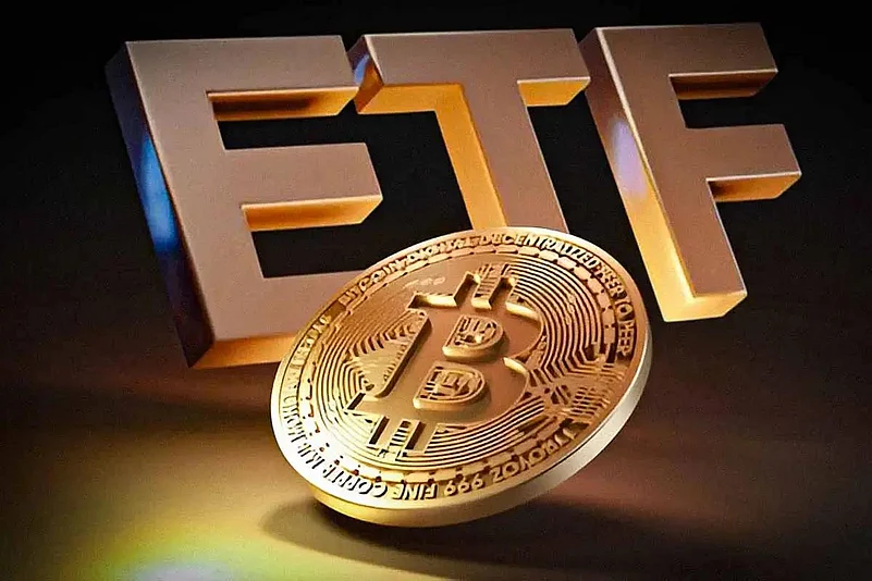 Golden ETF text and a Bitcoin coin