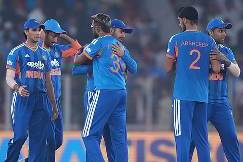 India's captain Suryakumar Yadav, right celebrate with teammates after their win in the fifth T20 cricket match against South Africa in Ahmedabad.