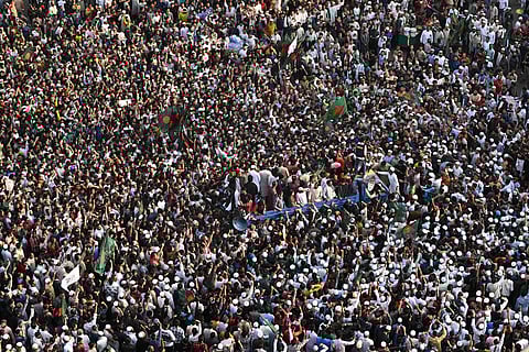Protesters shout slogans and block an intersection following overnight attacks and vandalism after the death of a prominent activist, who was shot by an assailant a week ago, in Dhaka, Bangladesh.