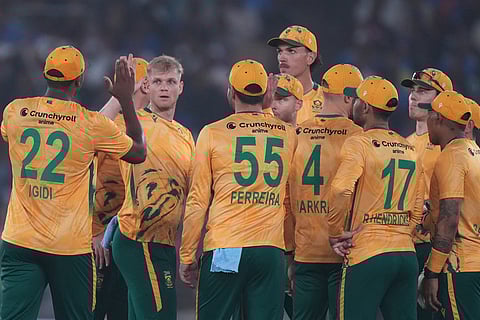 South Africa's Corbin Bosch, second from left, celebrates with teammates the dismissal of India's Abhishek Sharma during the fifth T20 cricket match between India and South Africa in Ahmedabad.
