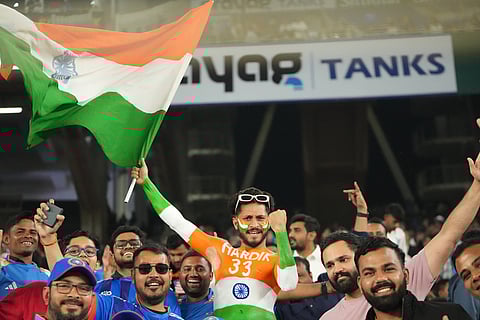 Indian fans cheers before the start of the fifth T20 cricket match between India and South Africa in Ahmedabad.