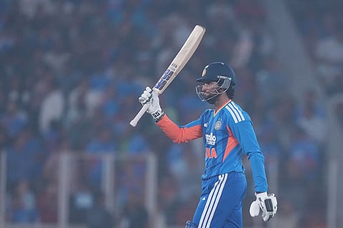 India's Tilak Varma celebrates after scoring fifty runs during the fifth T20 cricket match between India and South Africa in Ahmedabad.