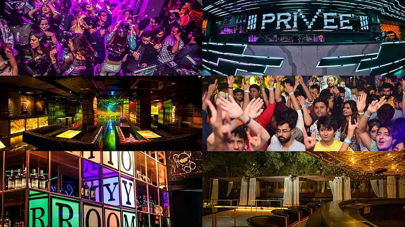 Crowded nightclub scene with people dancing under colorful lights