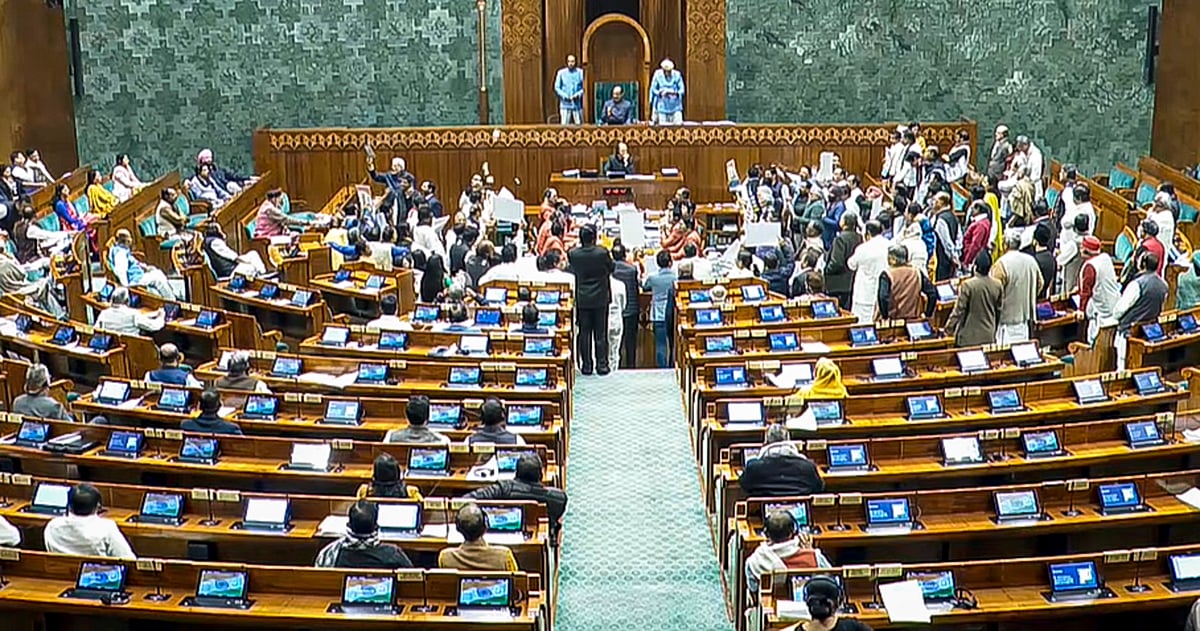 Opposition MPs protest in the well as Union Minister Shivraj Singh Chouhan (unseen) speaks in the Lok Sabha during the Winter session of Parliament - THIRD PARTY IMAGE; SCREENGRAB VIA SANSAD TV