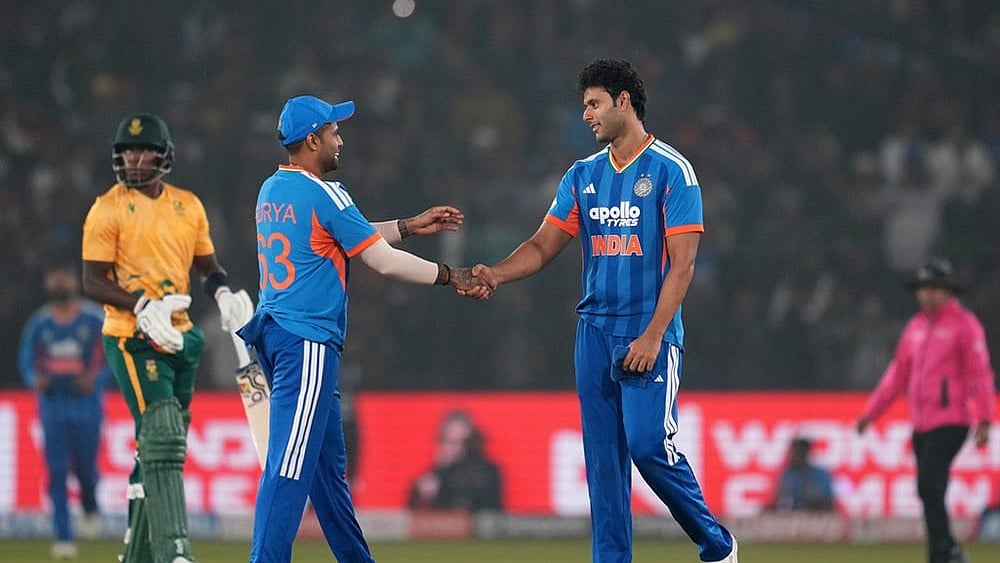 India's Shivam Dube, right, congratulates India's captain Suryakumar Yadav after winning the first T20 International cricket match between India and South Africa in Cuttack. - | Photo: AP/Rafiq Maqbool