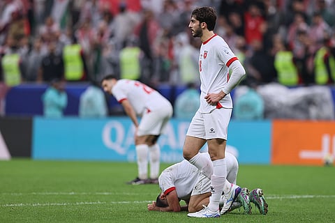 Jordan's are dejected at the end of the FIFA Arab Cup final soccer match between Jordan and Morocco in Lusail, Qatar.