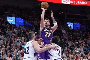 | Photo: AP/Rob Gray : Los Angeles Lakers guard Luka Doncic (77) shoots over Utah Jazz forward Kevin Love (42) and guard Keyonte George (3) during the second half of an NBA basketball game, in Salt Lake City.