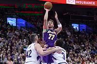 NBA: Luka Doncic's Fifth Triple-Double Of Season Helps Los Angeles Lakers Top Utah Jazz 145-135 | Photo: AP/Rob Gray : Los Angeles Lakers guard Luka Doncic (77) shoots over Utah Jazz forward Kevin Love (42) and guard Keyonte George (3) during the second half of an NBA basketball game, in Salt Lake City.