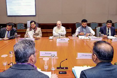 Union Home Minister Amit Shah, centre, chairs a meeting for the constitution of a dedicated body, the Bureau of Port Security (BoPS), for the security of vessels and port facilities. Union Minister of Ports, Shipping and Waterways, Sarbananda Sonowal and Union Minister of Civil Aviation K Rammohan Naidu are also seen. 