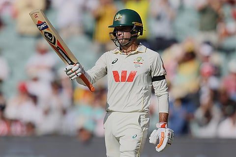 Australia's Alex Carey reacts after scoring 50 runs during play on day three of the third Ashes cricket test between England and Australia in Adelaide, Australia.