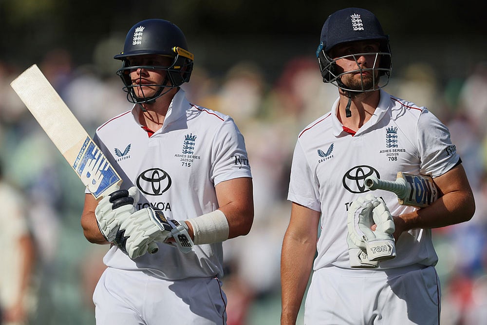 England's Jamie Smith, left, and Will Jacks walk from the field after play ended on day four of the third Ashes cricket test between England and Australia in Adelaide, Australia. - | Photo: AP/James Elsby