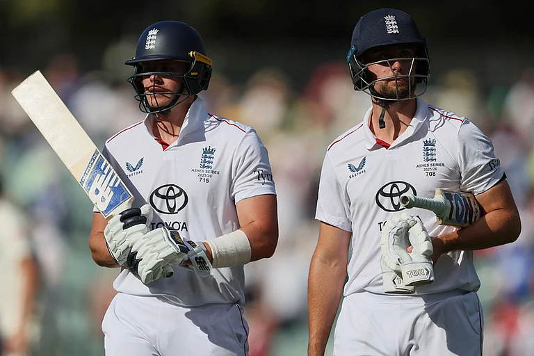 England's Jamie Smith, left, and Will Jacks walk from the field after play ended on day four of the third Ashes cricket test between England and Australia in Adelaide, Australia. - | Photo: AP/James Elsby