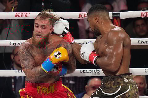 Anthony Joshua, right, punches Jake Paul during their heavyweight boxing match, in Miami, Fla.
