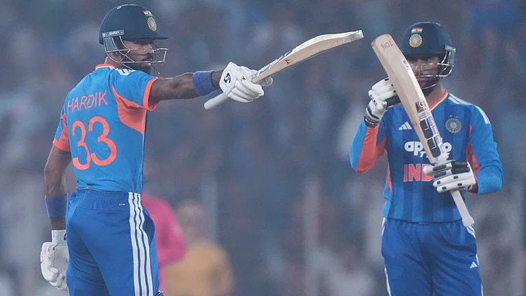 India's Hardik Pandya celebrates after scoring fifty runs during the fifth T20 cricket match between India and South Africa in Ahmedabad, India, Friday, Dec. 19, 2025. - | Photo: AP/Ajit Solanki