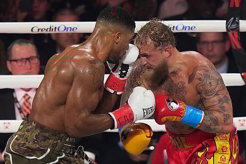 Anthony Joshua, left, in action against Jake Paul during their heavyweight boxing in Miami, Fla.