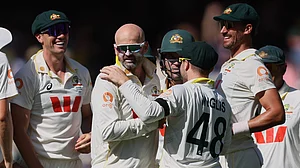 AP : Nathan Lyon, second left, is congratulated by teammates after dismissing Ben Stokes on day four of the third Ashes Test between England and Australia in Adelaide.