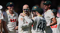 AP : Nathan Lyon, second left, is congratulated by teammates after dismissing Ben Stokes on day four of the third Ashes Test between England and Australia in Adelaide.
