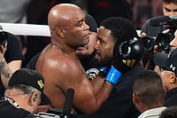 Anderson Silva Vs Tyron Woodley: Brazilian MMA Legend Wins With Second-Round TKO | Photo: AP/Lynne Sladky : Anderson Silva, center left, is embraced after his knockdown of Tyron Woodley during their cruiserweight fight in Miami.