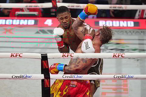 Jake Paul, right, and Anthony Joshua compete in their heavyweight boxing match in Miami, Fla.