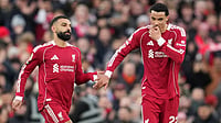 Tottenham Hotspur Vs Liverpool Live Score, Premier League 2025-26: Spurs Set To Face Reds | Photo: AP/Jon Super : Liverpool's Mohamed Salah, left, and Liverpool's Hugo Ekitike greet each other during the English Premier League soccer match between Liverpool and Brighton and Hove Albion in Liverpool, England.