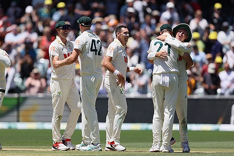 Australia's players celebrate after winning the third Ashes Test against England in Adelaide, Australia.