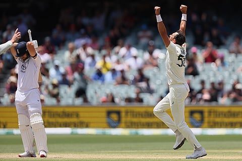 Australia's Mitchell Starc, right, celebrates the wicket of England's Will Jacks, left, during play on the final day of the third Ashes cricket test between England and Australia in Adelaide, Australia.