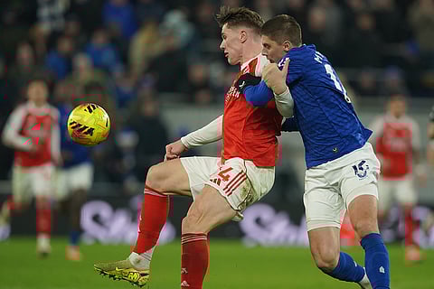Arsenal's Viktor Gyoekeres, left, is challenged by Everton's Vitaliy Mykolenko during the English Premier League soccer match between Everton and Arsenal in Liverpool, England.