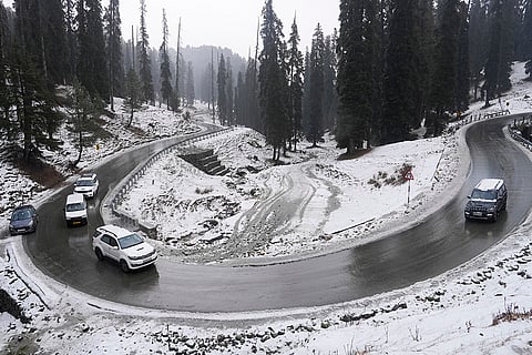 Vehicles pass through a snow-covered valley after fresh snowfall on the first day of ‘Chillai Kalan’, in Gulmarg, Baramulla district, Jammu and Kashmir. ‘Chillai Kalan’ is a 40-day harsh winter period in Kashmir which begins on December 21 every year and ends on January 31. 