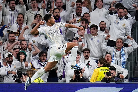 Real Madrid's Jude Bellingham celebrates after scoring the opening goal during the Spanish La Liga soccer match between Real Madrid and Sevilla in Madrid, Spain.