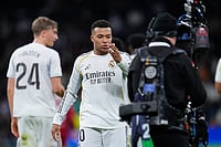 | Photo: AP/Manu Fernandez : Real Madrid's Kylian Mbappe blows a kiss towards the TV camera as he celebrates after scoring his sides second goal during the Spanish La Liga soccer match between Real Madrid and Sevilla in Madrid, Spain.